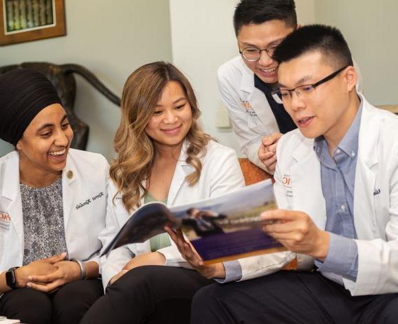 four doctor of pharmacy students in lounge